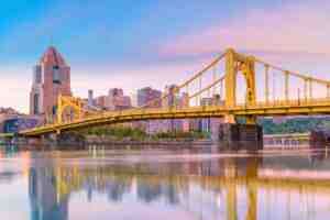 Pittsburgh skyline and yellow bridge over the river